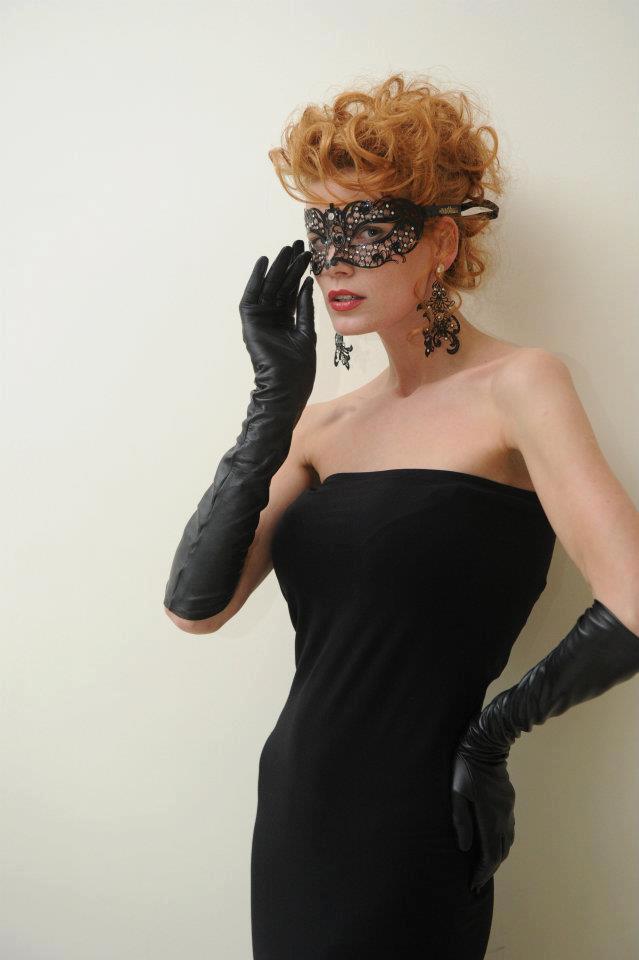 Russian model Anna Maliboga wearing a pair of black leather opera gloves.